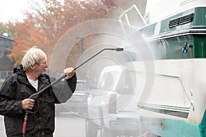 Man Power Washing Boat