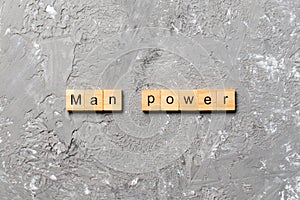 Man Power word written on wood block. Man Power text on cement table for your desing, concept