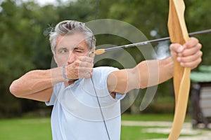 man practicing archery