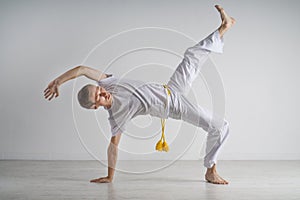 Man practicing capoeira , brazilian martial art.