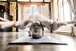 Man practicing complicated yoga asana