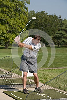 Man Practicing Golf photo