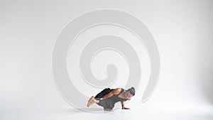 Man practicing intense yoga asana