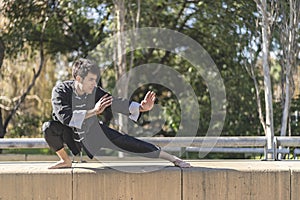 Man practicing Kung Fu in the park