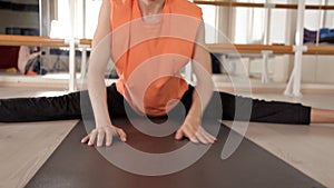 Man practicing yoga in the gym.Man doing yoga asanas in the light of the Studio. Bright Studio with large Windows and