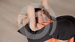 Man practicing yoga in the hall.Bright Studio with large Windows and mirrors. Sportswear