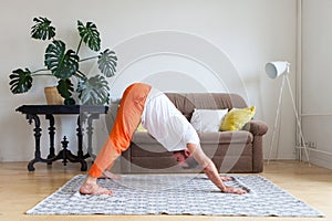 Man practicing yoga and meditation at home. A series of yoga poses. Lifestyle concept