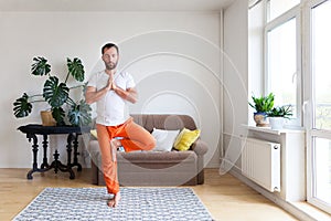 Man practicing yoga and meditation at home. A series of yoga poses. Lifestyle concept