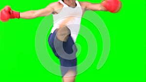 A man practises kickboxing