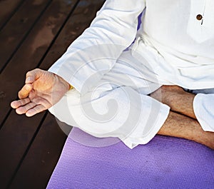 Man practising yoga for meditation