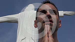 Man Praying at Cristo Rey Statue