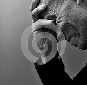 man praying with hand on bible on grey background with people stock image stock photo