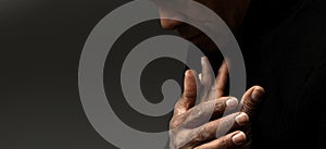 man praying with hand on bible on grey background with people stock image stock photo