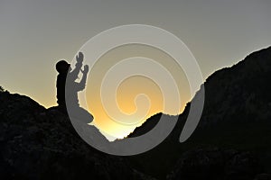 Man praying on mountain