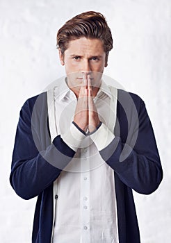 Man is praying, portrait and worship for anxiety about life crisis, religion and faith in God on white background