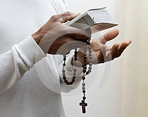 man praying to god with bible with background with people stock image stock photo