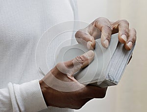 man praying to god with bible with background with people stock image stock photo