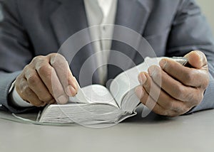 man praying to god with bible with background with people stock image stock photo