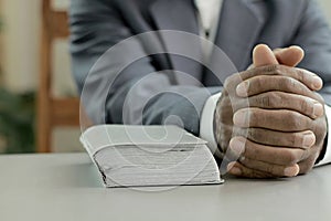 man praying to god with bible with background with people stock image stock photo