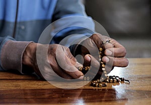 man praying to god with bible with background with people stock image stock photo