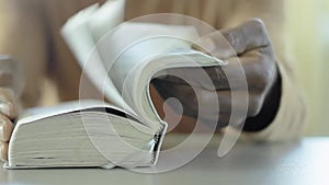 man praying to God with bible and worshipping with hands together Caribbean man praying with people stock video stock footage