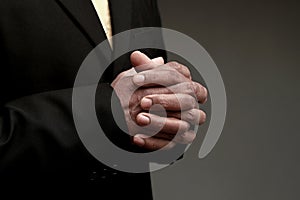 man praying to god with black grey background with people stock image stock photo