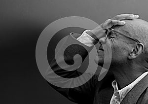 man praying to god with black grey background with people stock image stock photo