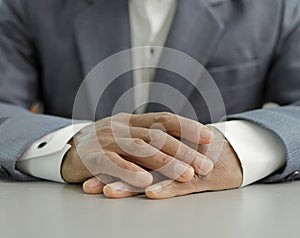 man praying to God worshipping with hands together Caribbean man praying with people stock image stock photo