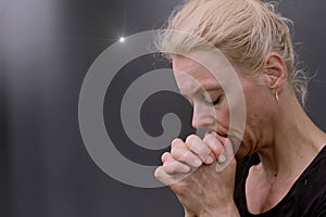 man praying to God worshipping with hands together with people stock image stock photo