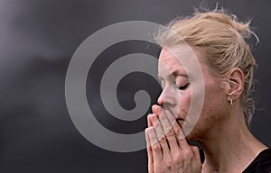 man praying to God worshipping with hands together with people stock image stock photo