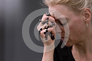 man praying to God worshipping with hands together with people stock image stock photo