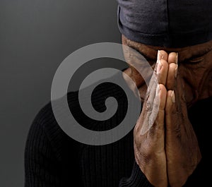 man praying to God worshipping with hands together with people stock image stock photo
