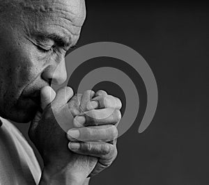 man praying to God worshipping with hands together with people stock image stock photo