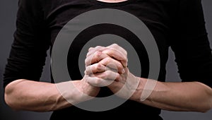 man praying to God worshipping with hands together with people stock image stock photo