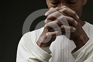 man praying to God worshipping with hands together with people stock image stock photo
