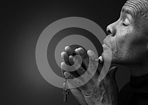 man praying to God worshipping with hands together with people stock image stock photo