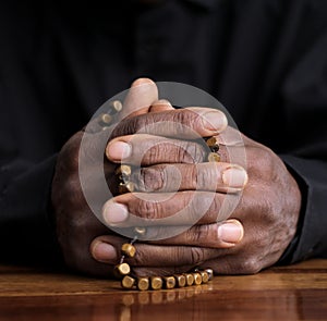 man praying to God worshipping with hands together with people stock image stock photo