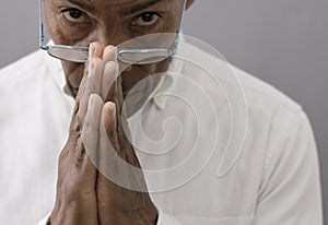 man praying to God worshipping with people stock image stock photo