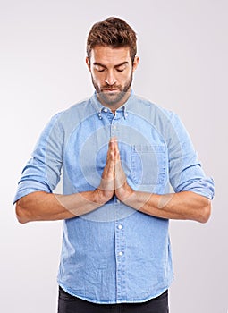 Man, praying and worship with faith in God, seek help and advice for guidance with hands together on white background