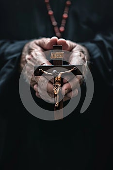 a man prays with a cross in his hands