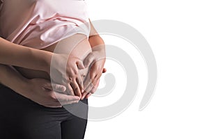 Man and pregnant woman caressing her belly