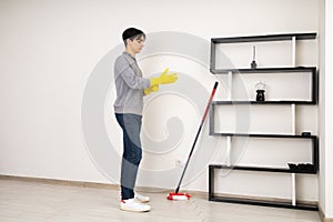 Man Preparation for Laminate Mopping. House Cleaning