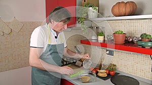 A man prepare a typical dish of Puglia friselle, pouring water to moisten frisa