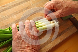 Man prepares scallions