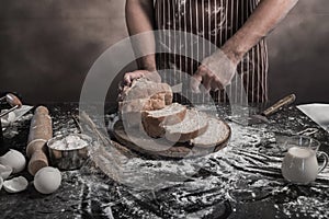 Man preparing buns at table in bakery