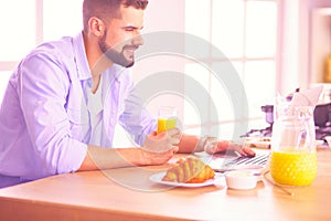 Man preparing delicious and healthy food in the home kitchen