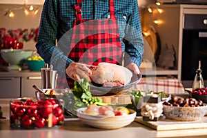 Man preparing delicious and healthy food in the home kitchen for christmas Christmas Duck or Goose