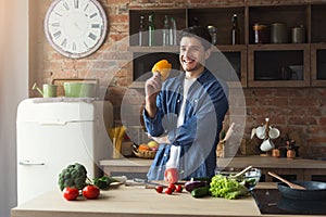 Man preparing delicious and healthy food in the home kitchen