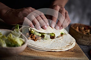 Man preparing a durum or a burrito photo