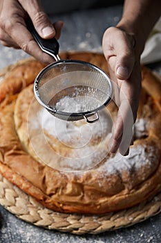 Man preparing ensaimada typical of Mallorca, Spain photo